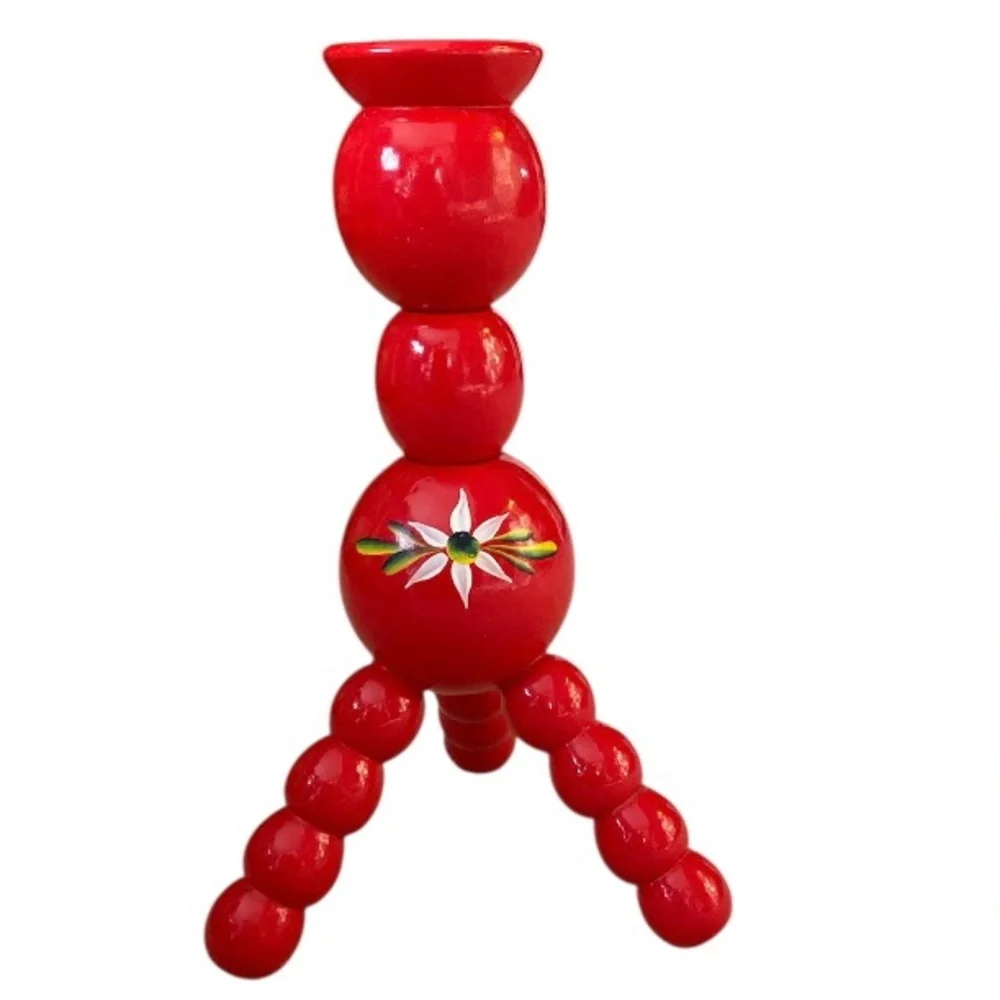 Vintage Swedish folk art wooden candle holder with a hand-painted daisy motif.